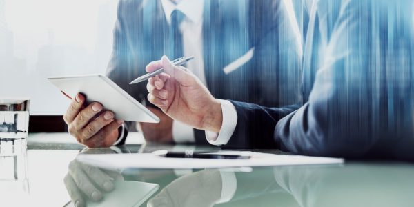 corporate-businessmen-working-tablet-office_53876-97637