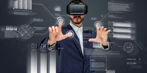 male-suit-with-virtual-reality-glasses-his-head-working-virtual-financial-world_613910-306